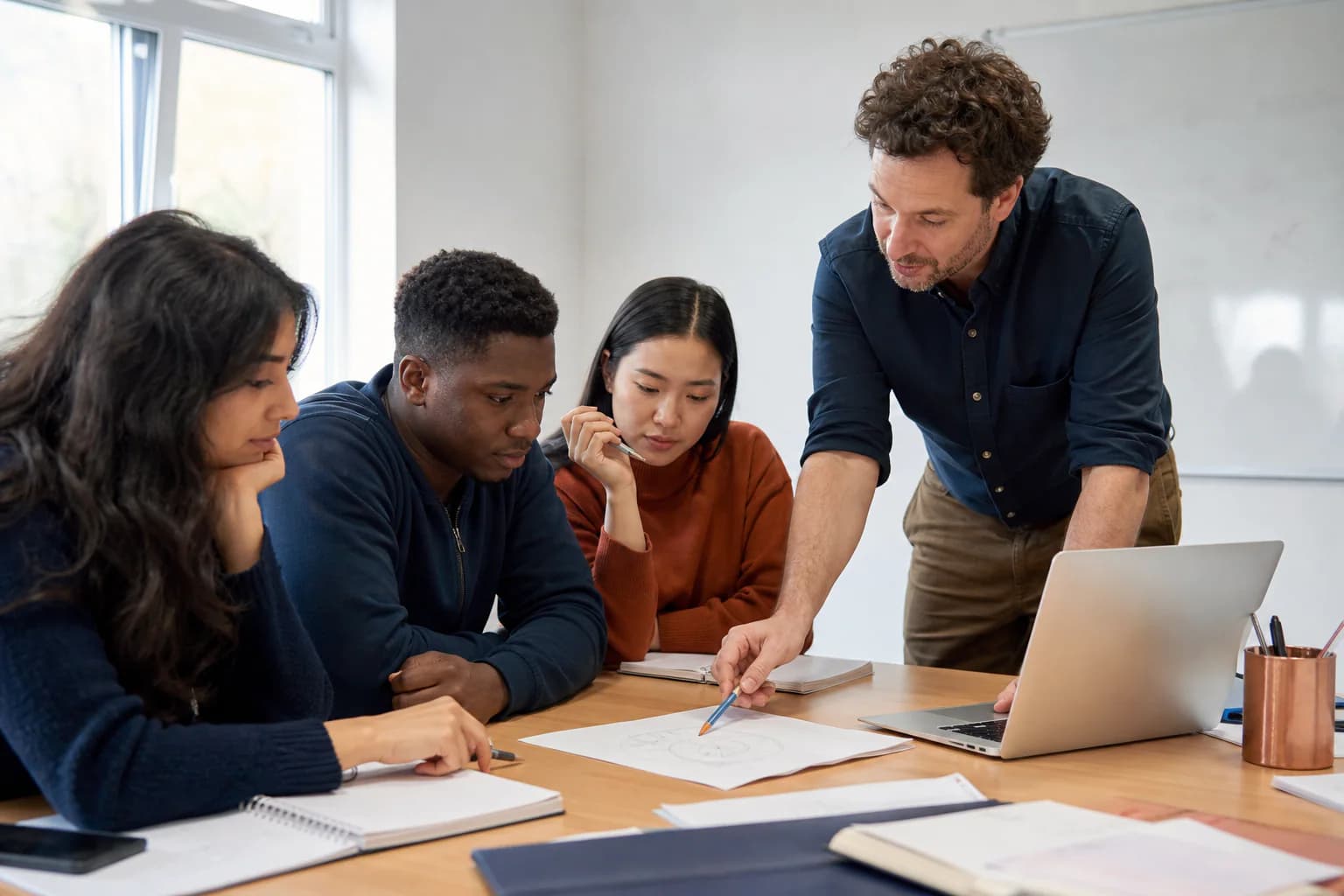 Adult Foundation learners review a problem with a tutor
